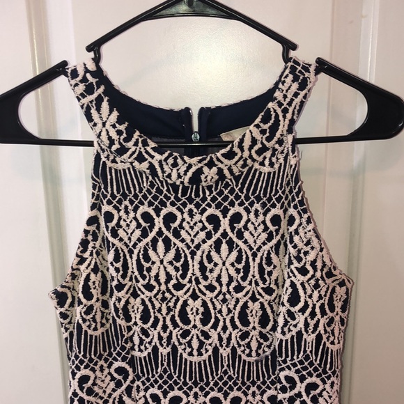 A navy dress w/ white embroidery and a sheer back - Picture 2 of 5
